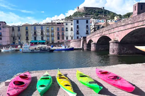Colourful kayaks on the riverbank in Bosa, Sardinia