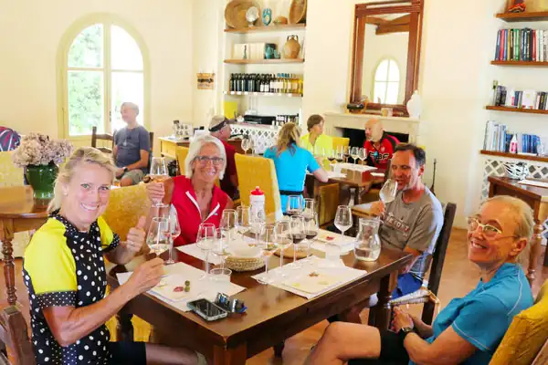 Cyclists at a wine tasting in Alghero, Sardinia